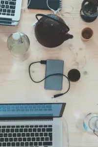 A bunch of laptops on a table from above